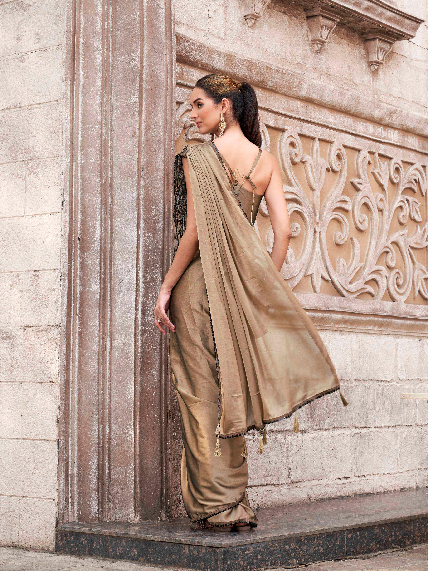 Brown colored designer saree with sequence and beads embroidery on shoulder portion